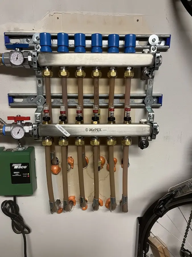 Plumber performing Water Heater Repair at a residential property in Hudson